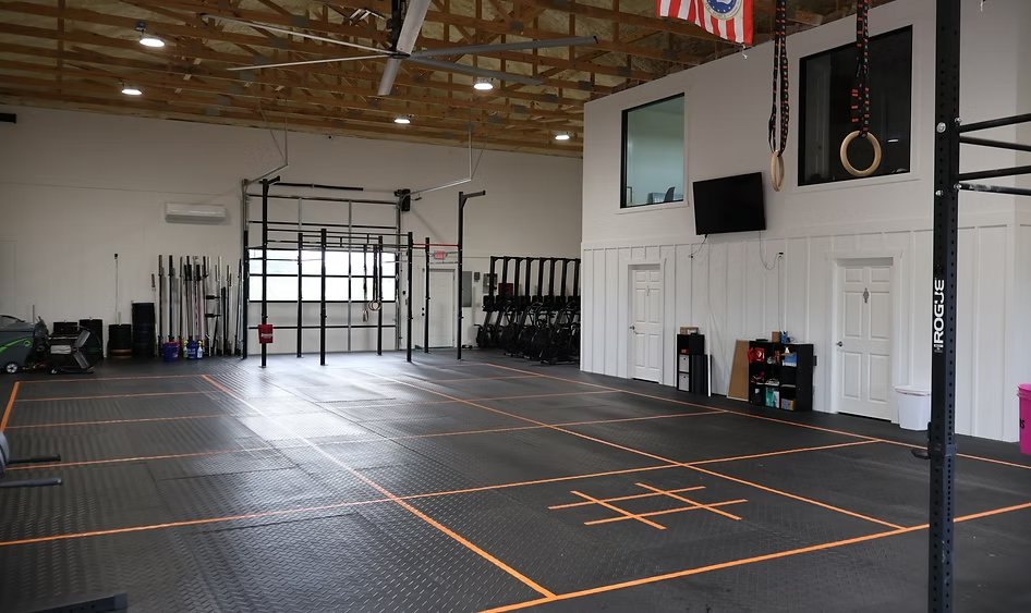 The CrossFit Inola training floor with Rogue rigs